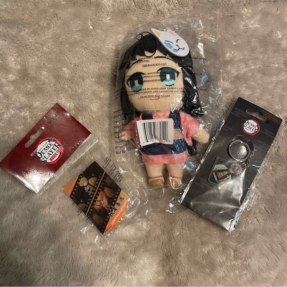 Demon slayer plushy, key chain, and acrylic card